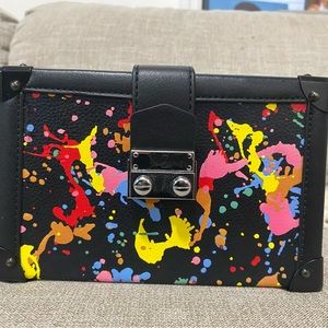 Never worn, structured with a splash of color cross body